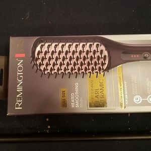 Heated smoothing brush